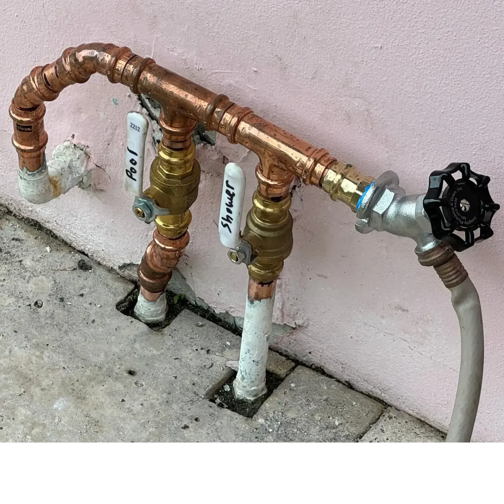 New copper manifold and hose bib installed