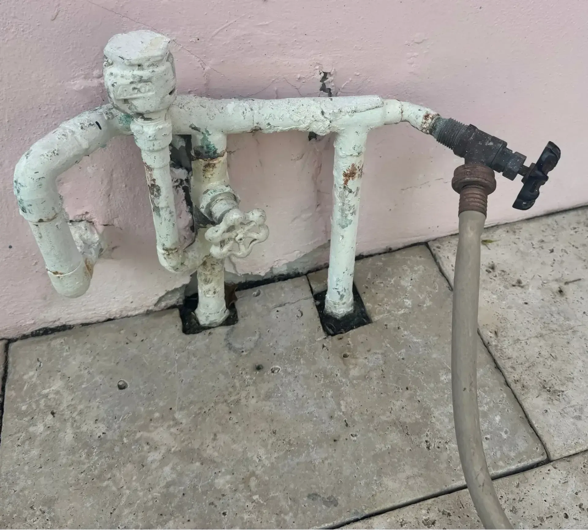 Old exterior piping before replacement